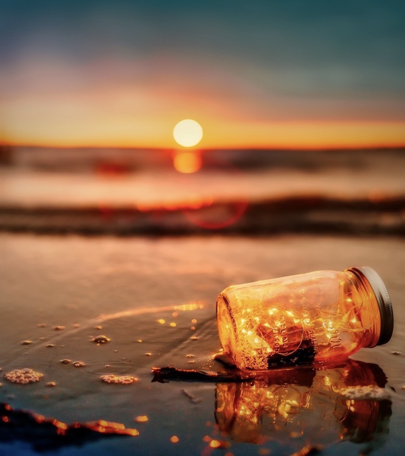 sunset and jar on the sand